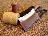 Dog bite tug made of leather with handle Dog bite tug made of leather with handle